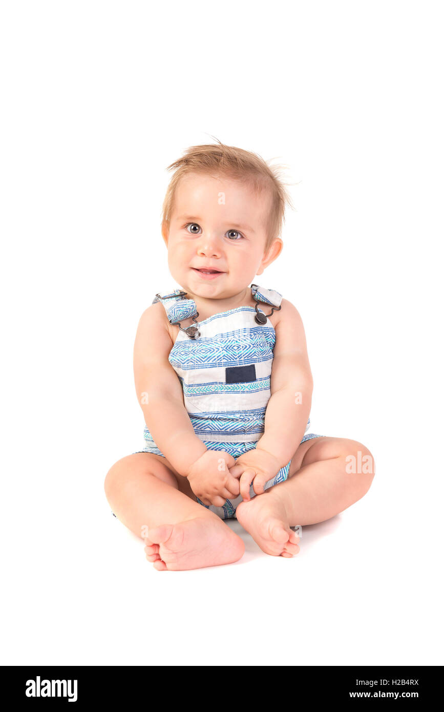 Beau Bébé posant isolé en fond blanc Banque D'Images