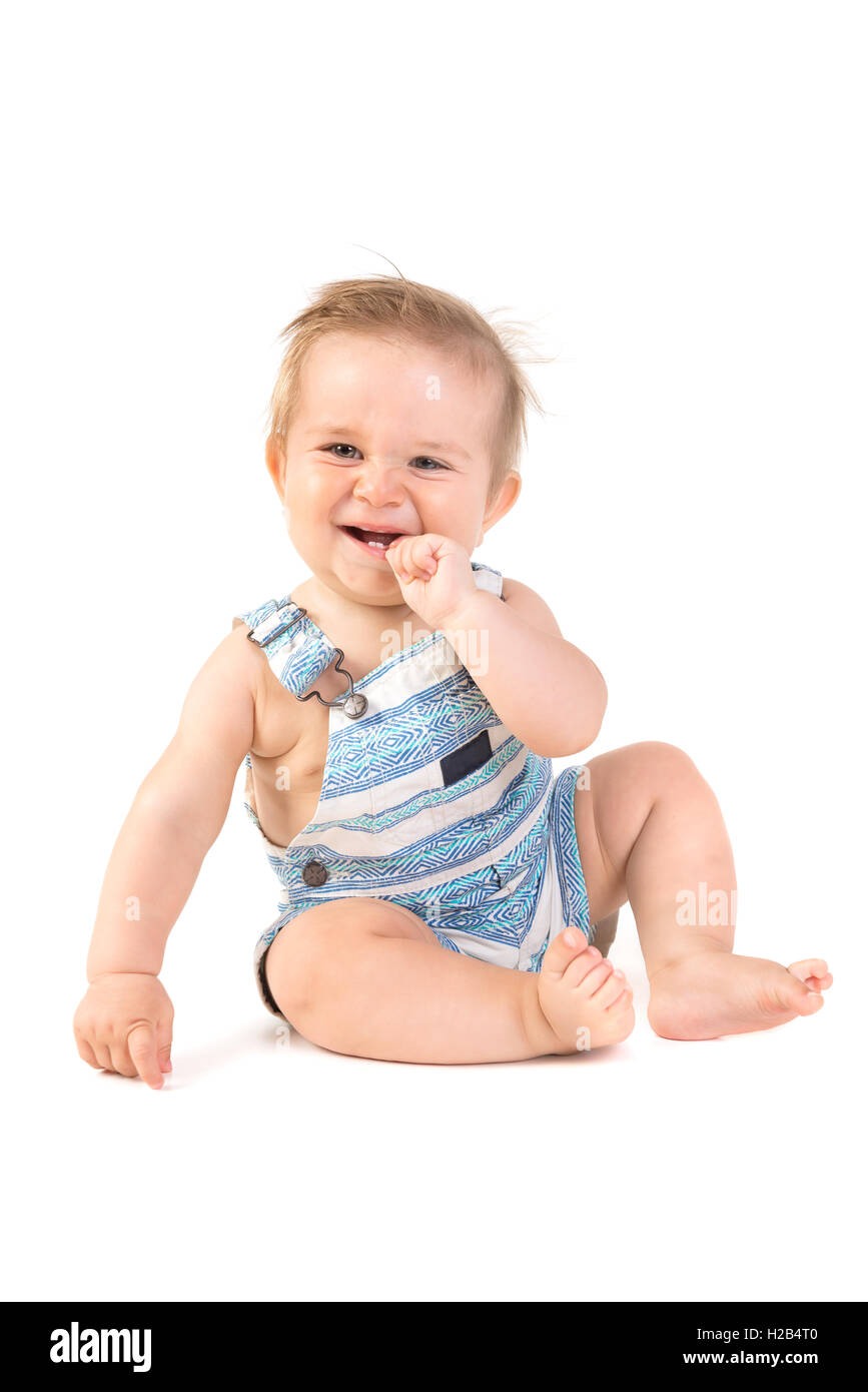 Beau Bébé posant isolé en fond blanc Banque D'Images