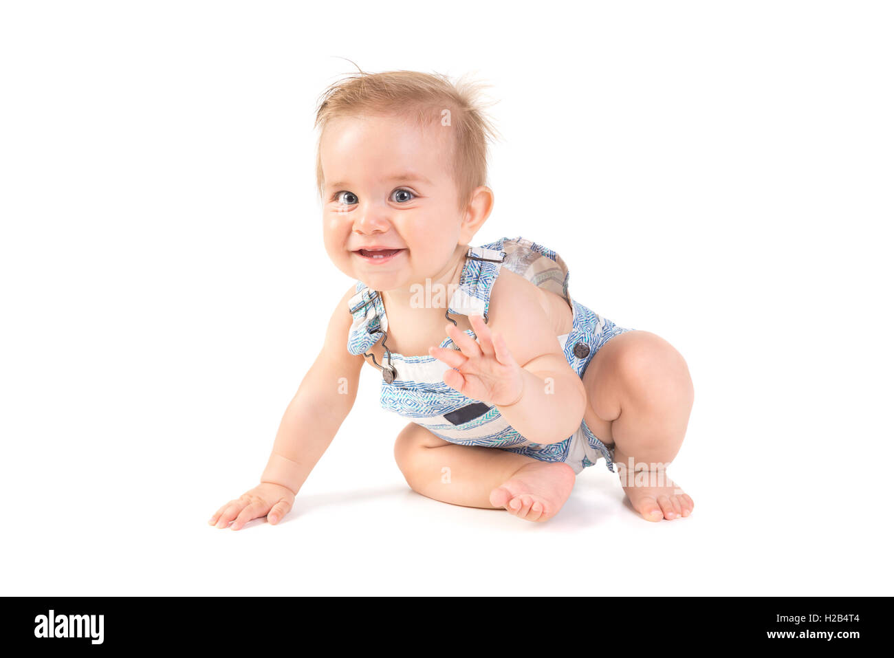 Beau Bébé posant isolé en fond blanc Banque D'Images