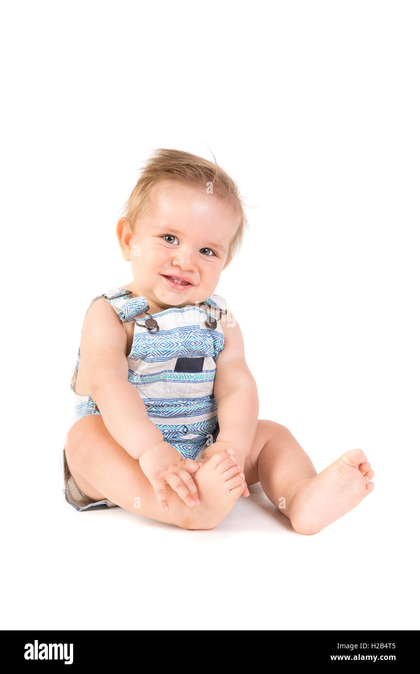 Beau Bébé posant isolé en fond blanc Banque D'Images