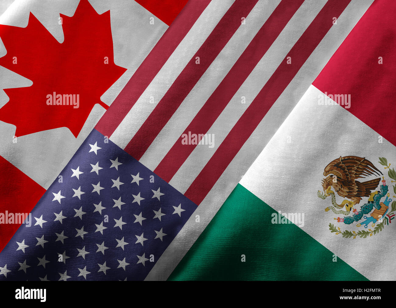 Close up des drapeaux de l'Accord de libre-échange nord-américain de l'ALENA sur la texture du textile. Banque D'Images