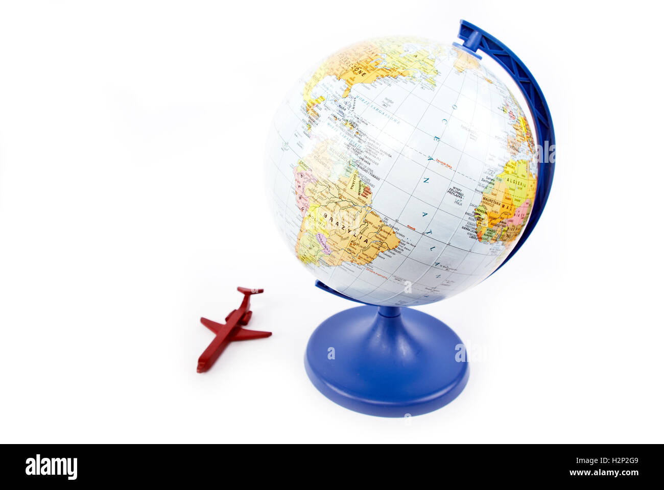 Globe avec un avion en rouge Banque D'Images