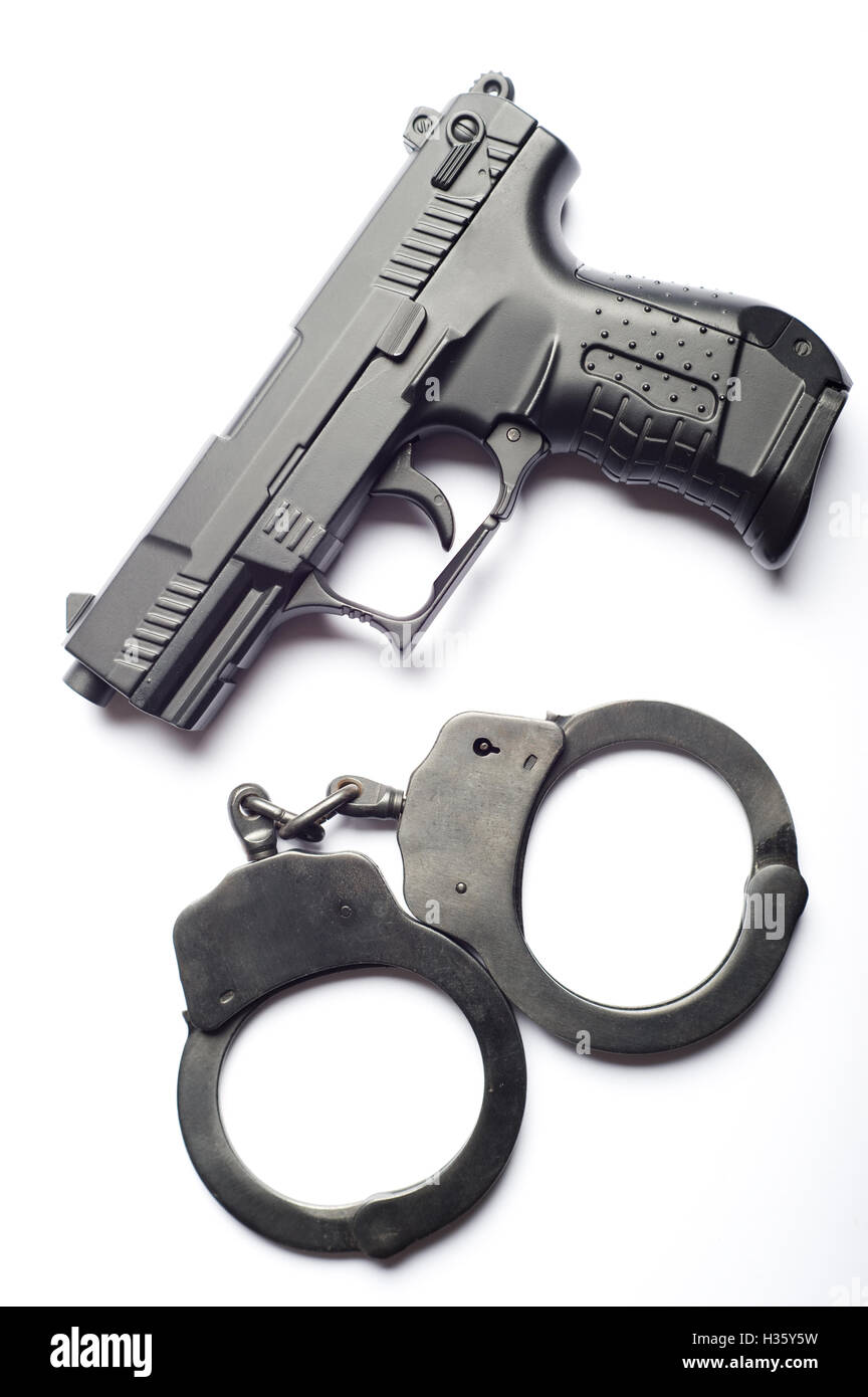 Pistolet et menottes Banque D'Images