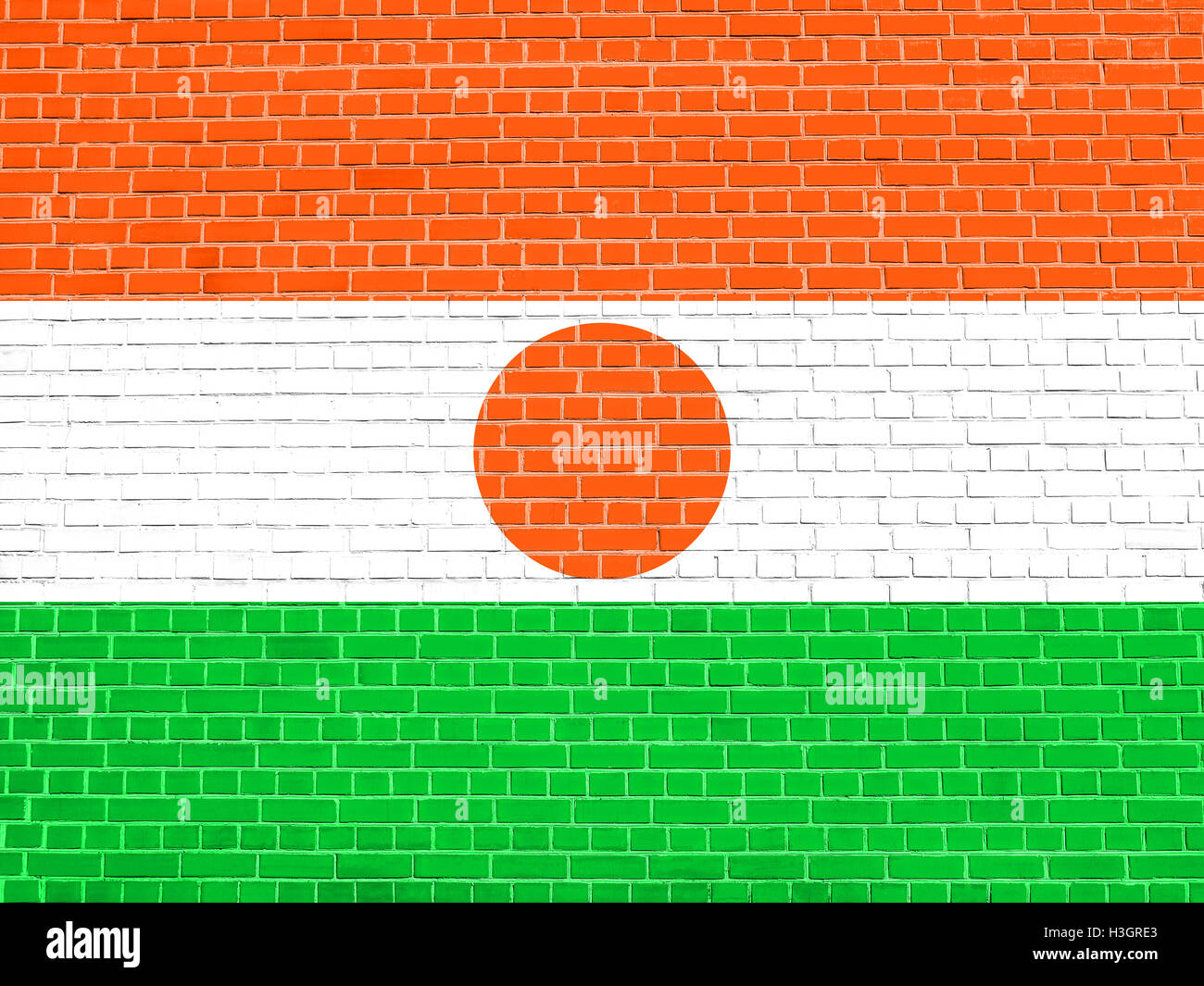 Drapeau officiel national nigérien. Symbole patriotique africaine, bannière, élément, arrière-plan. Pavillon du Niger le brick wall texture Banque D'Images