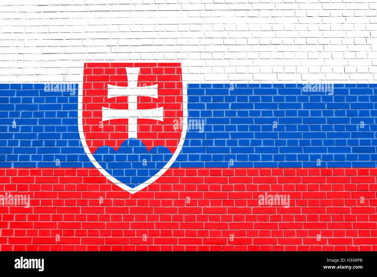 Symbole national slovaque. La conception de fond patriotique. Drapeau de la Slovaquie sur mur de brique texture background Banque D'Images