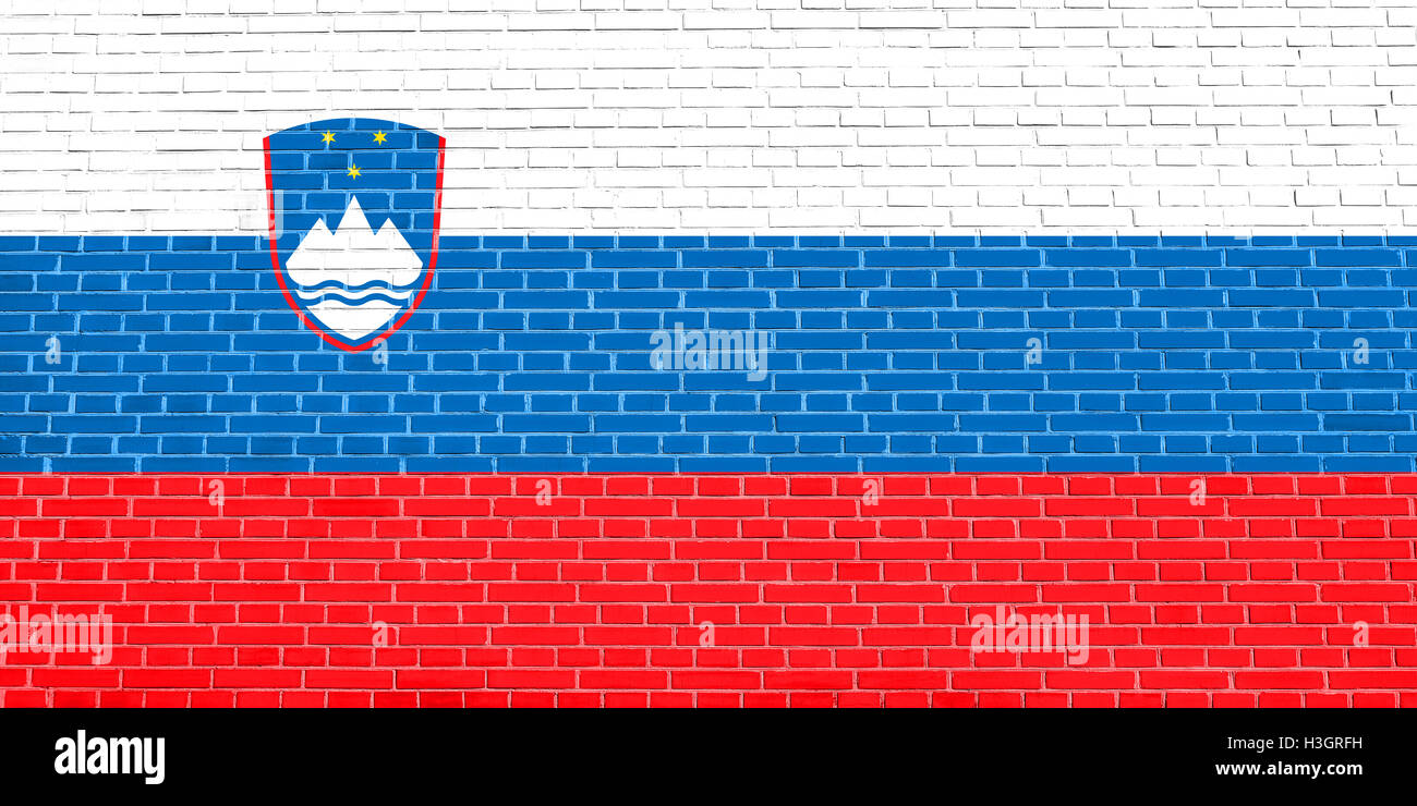 Symbole national de la Slovénie. La conception de fond patriotique. Drapeau de la Slovénie sur mur de brique texture background Banque D'Images