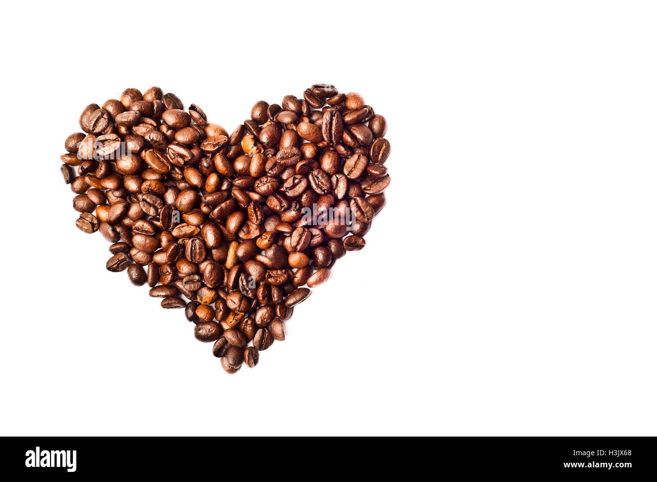 L'amour pour le café - forme de coeur Saint-Valentin faite avec les grains de café Banque D'Images