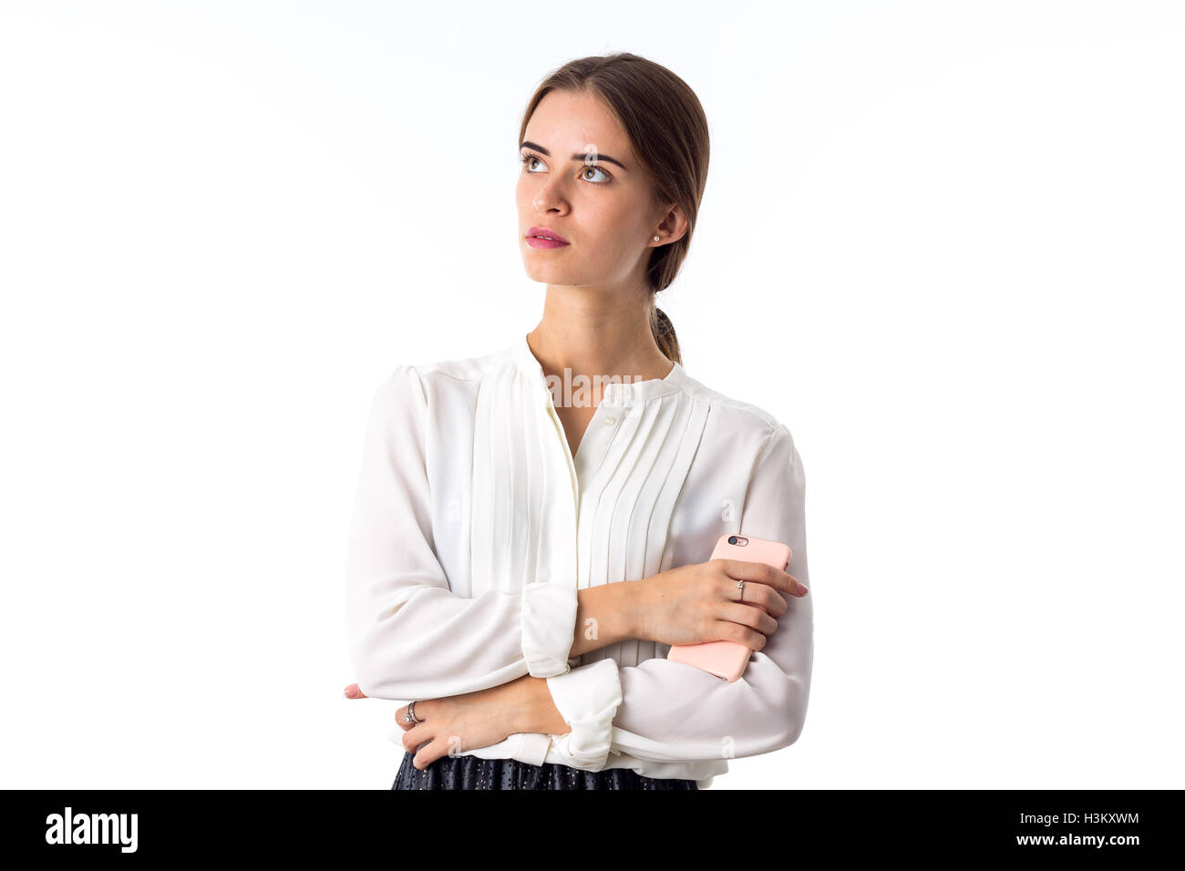 Young woman holding phone Banque D'Images