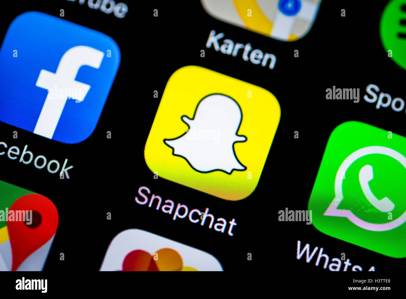 L'écran du Smartphone avec SnapChat, WhatsApp, Facebook app icons Banque D'Images