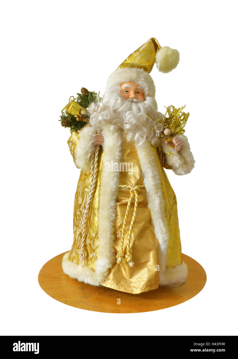 Un vieux temps / antique représentation figurine du Père Noël vêtu de robes d'or. Banque D'Images