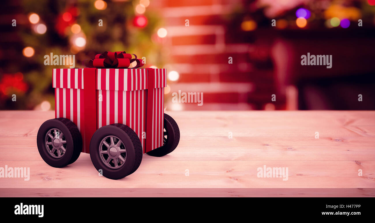 Image composite du bar rayé rouge et blanc boîte-cadeau avec roues Banque D'Images