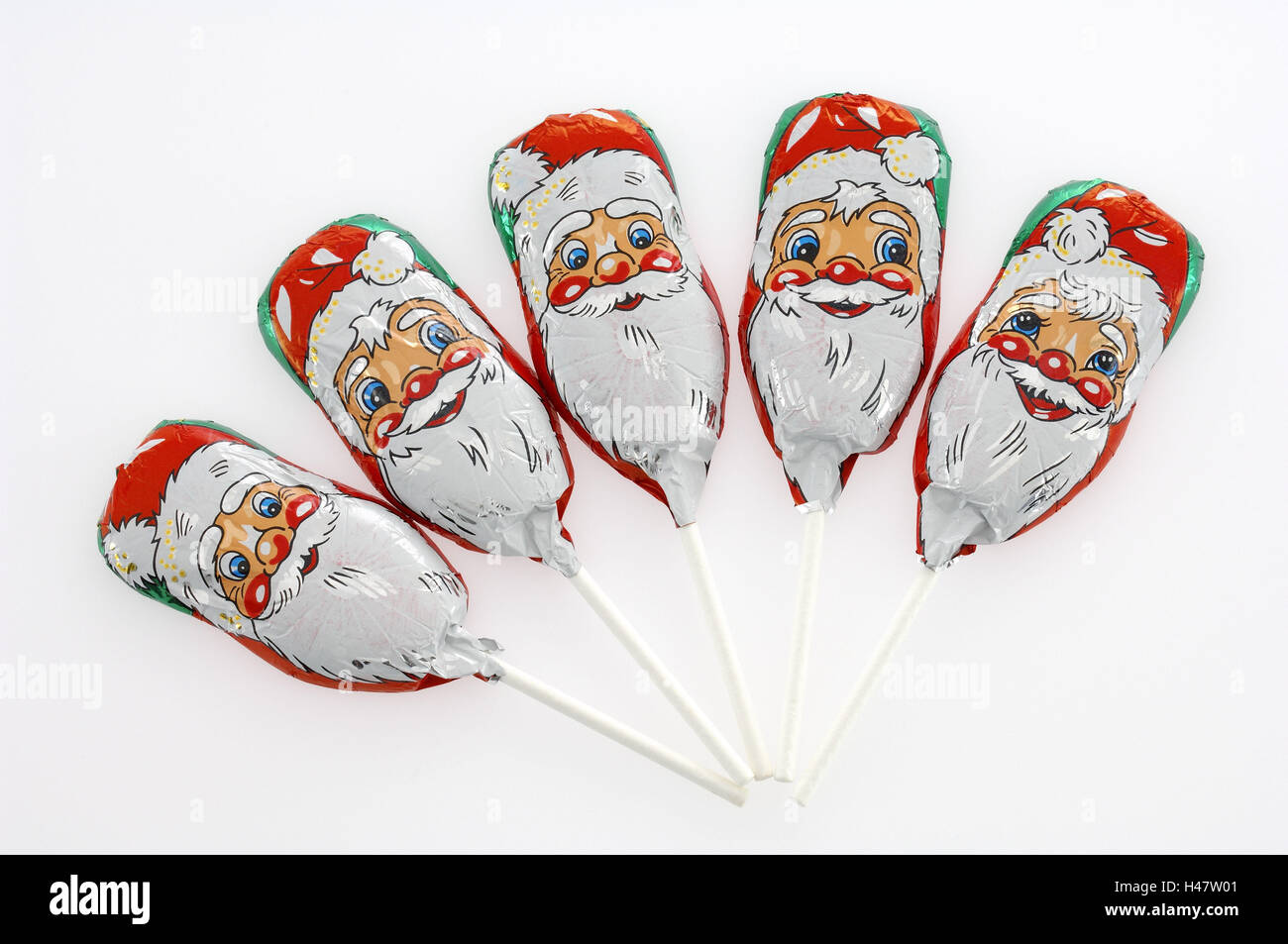 Santas, sucettes, chocolat Banque D'Images
