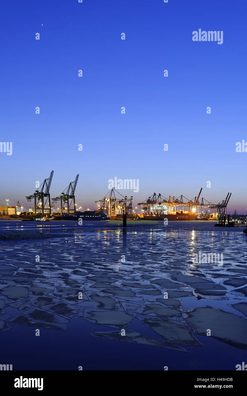 La glace flottante sur l'Elbe, les grues, crépuscule, soir, humeur Neumühlen, ville hanséatique de Hambourg, Allemagne, Banque D'Images