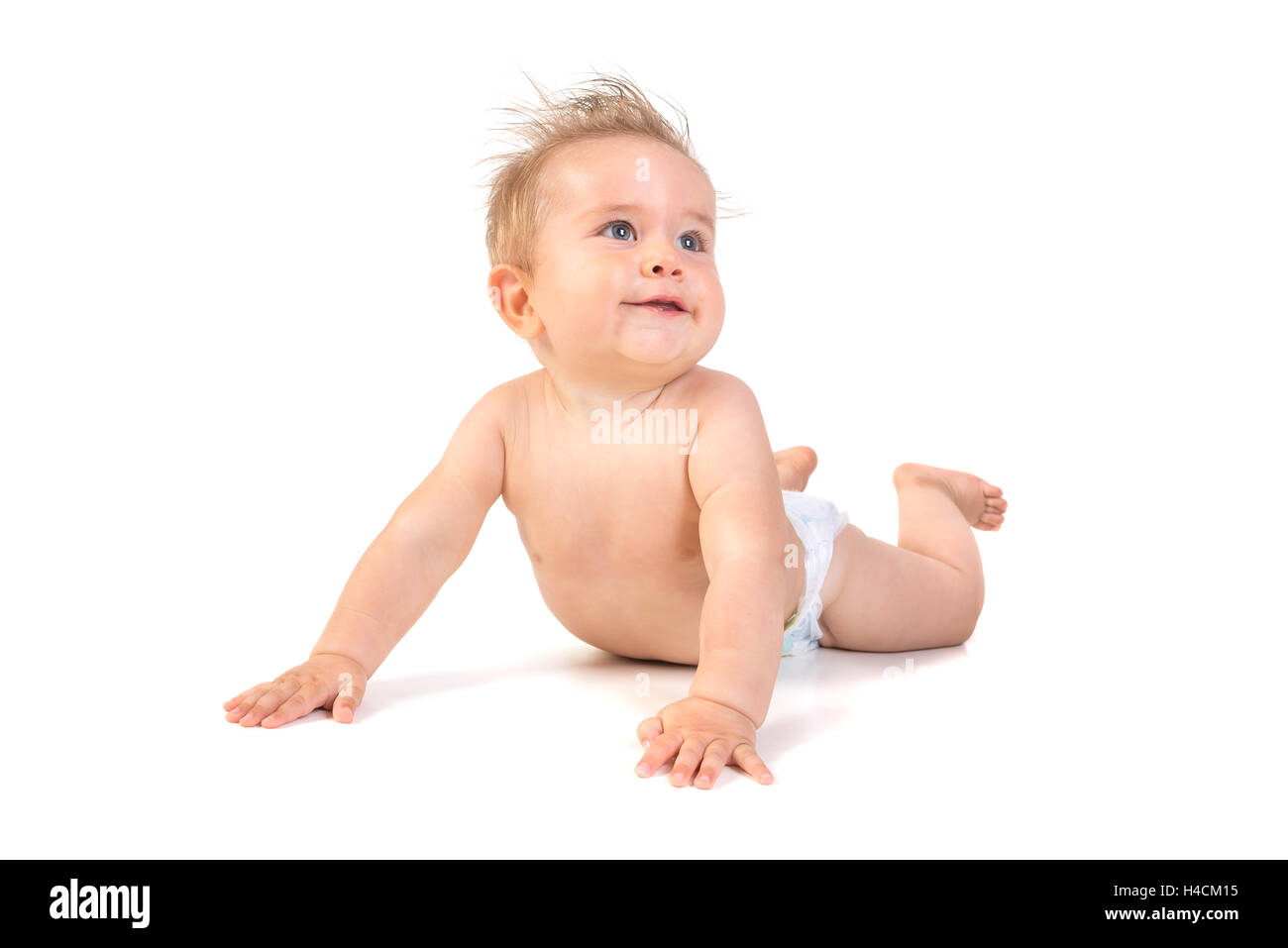 Magnifique petit garçon posant isolé en fond blanc Banque D'Images