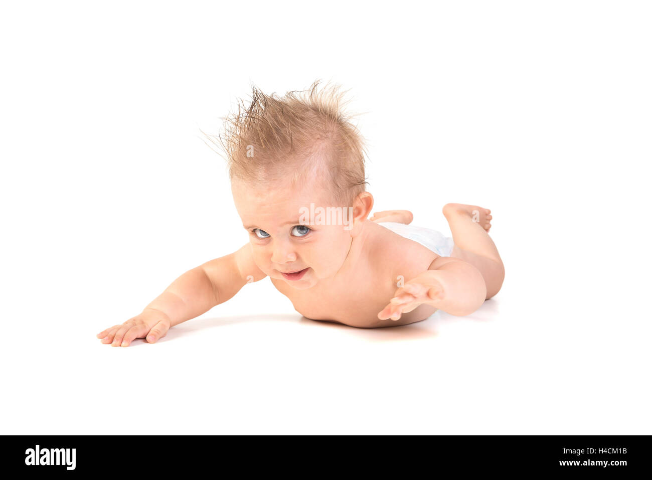 Magnifique petit garçon posant isolé en fond blanc Banque D'Images