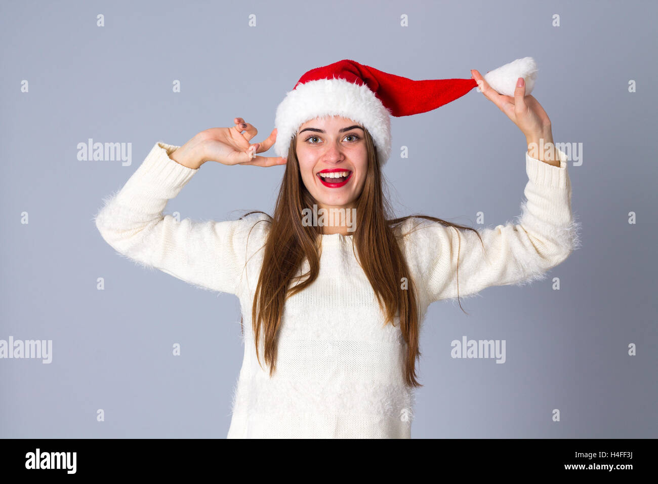 Woman in red christmas hat Banque D'Images