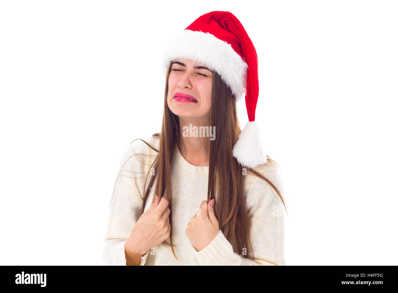 Woman in red christmas hat pleurer Banque D'Images