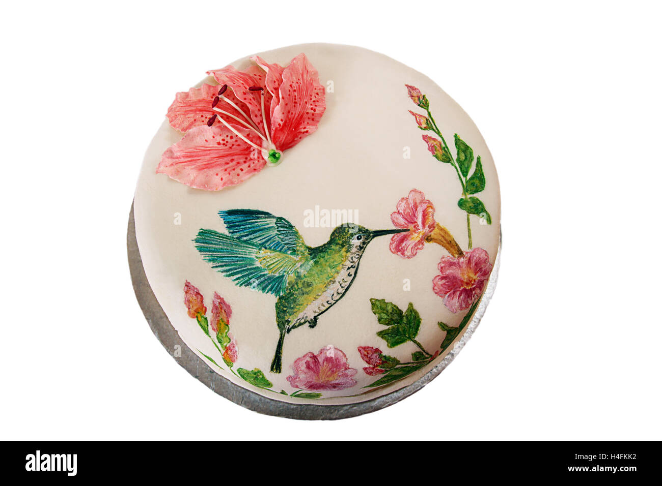 Gâteau avec du fondant et peint oiseau-oiseau et fleurs Banque D'Images