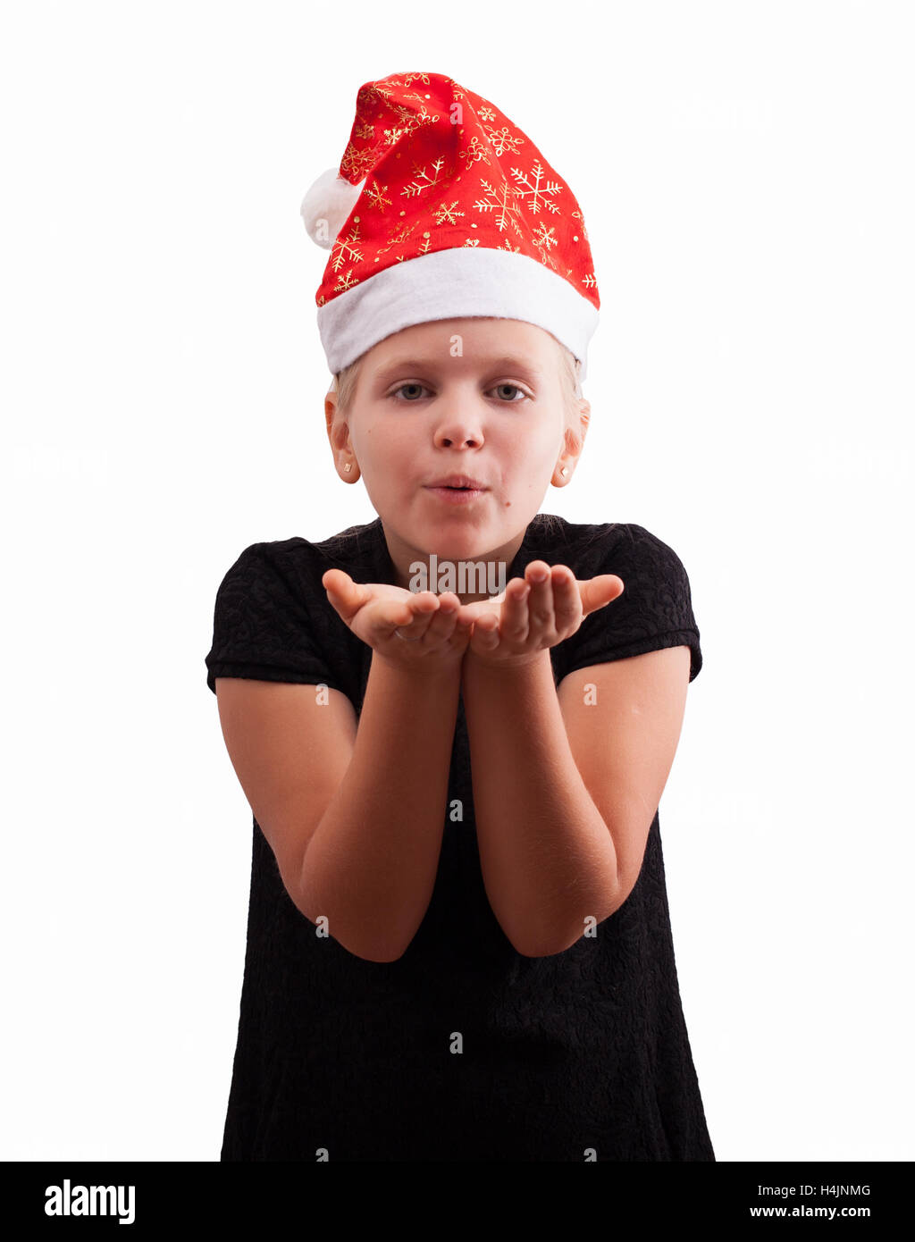 Girl in a red Christmas hat l'envoi d'un baiser Banque D'Images