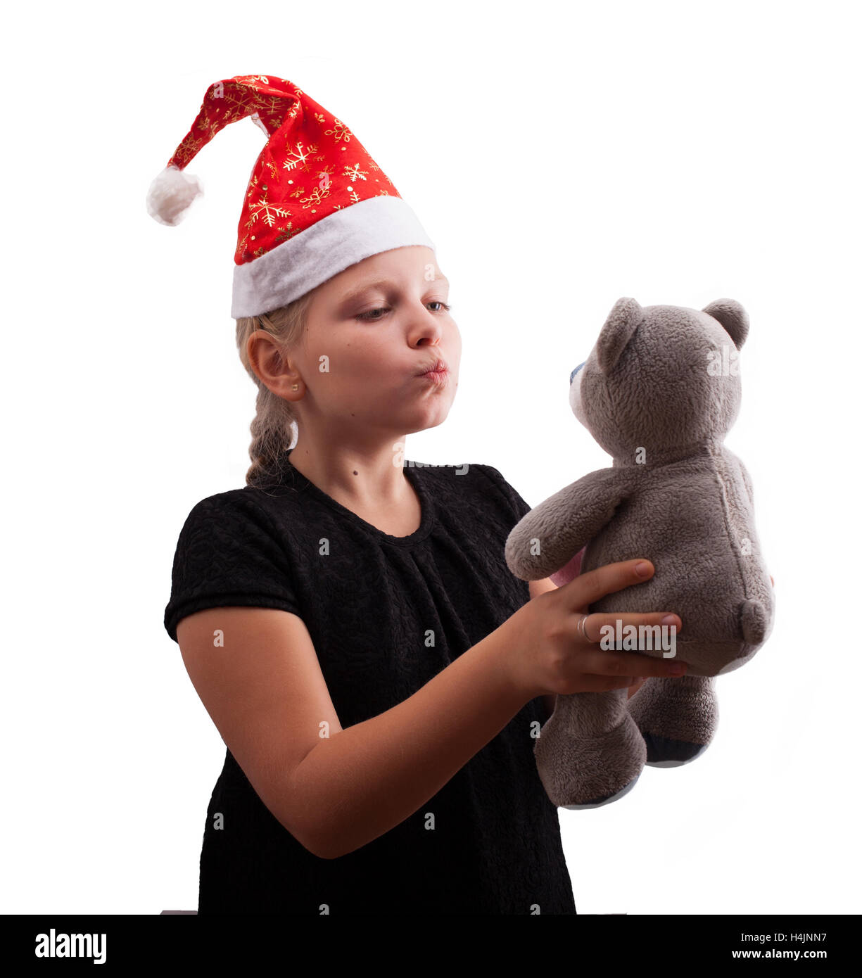 Girl in Red Hat et l'ours de Noël Banque D'Images