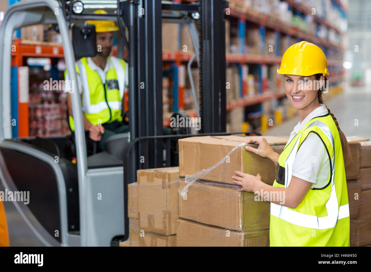 Portrait of female worker smiling Banque D'Images Portrait of female worker smiling Banque D'Images