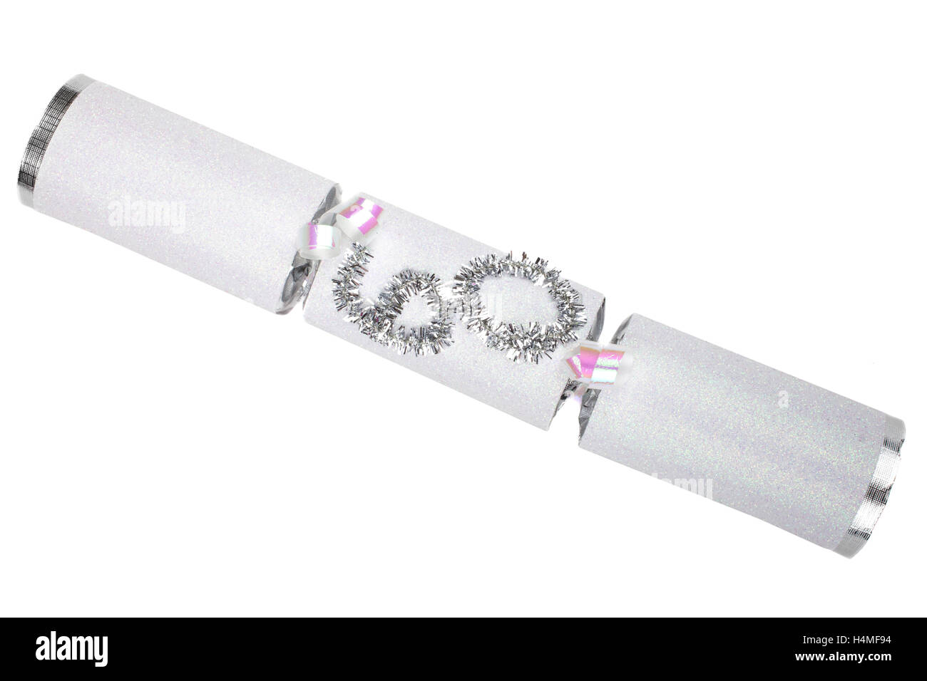 La prise d'un 60e anniversaire ou anniversaire Cracker aussi connu comme un bon bon. Un pirate se compose d'un tube de carton enveloppé dans un b Banque D'Images