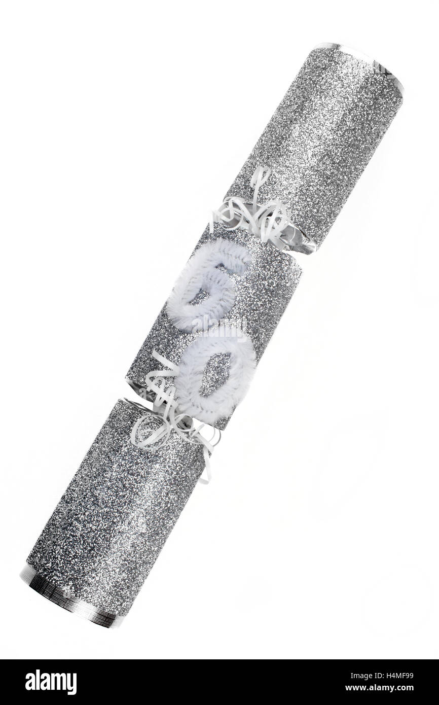 La prise d'un 60e anniversaire ou anniversaire Cracker aussi connu comme un bon bon. Un pirate se compose d'un tube de carton enveloppé dans un b Banque D'Images