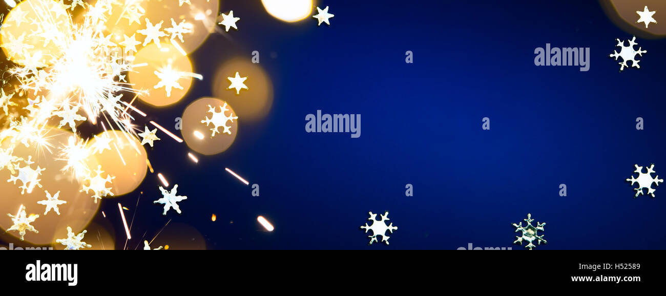 Vacances de Noël de lumière sur fond bleu Banque D'Images