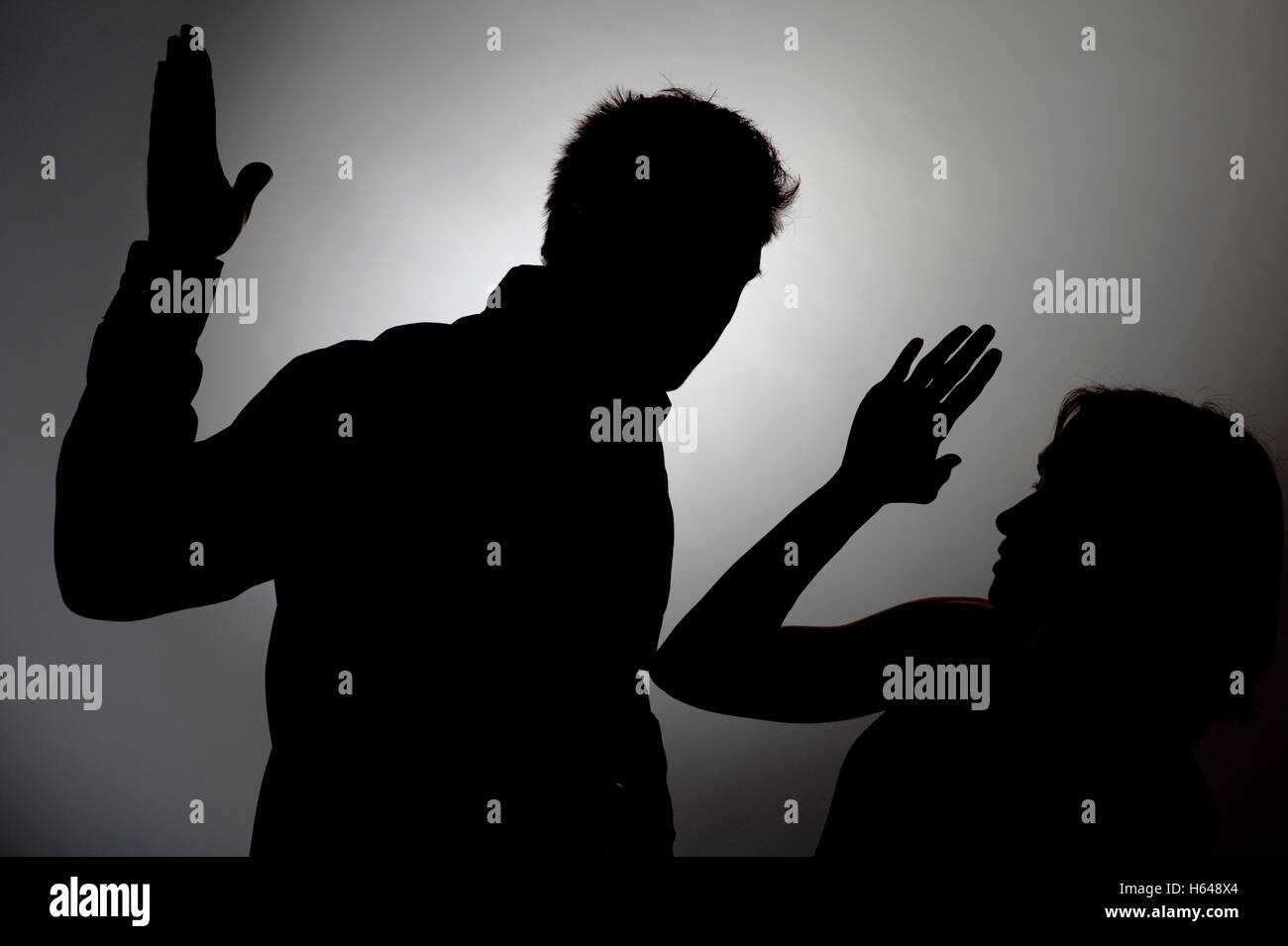Battre l'homme femme, silhouette Banque D'Images