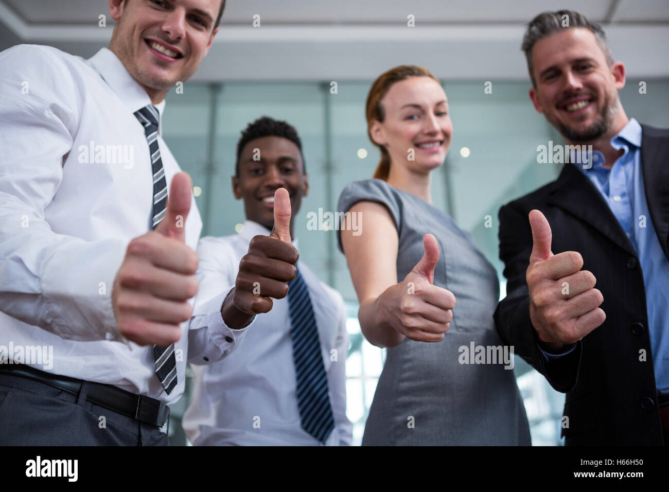 Business executive showing Thumbs up in office Banque D'Images