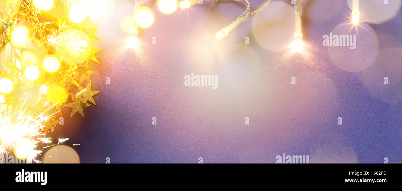 Vacances de Noël de lumière sur fond bleu Banque D'Images