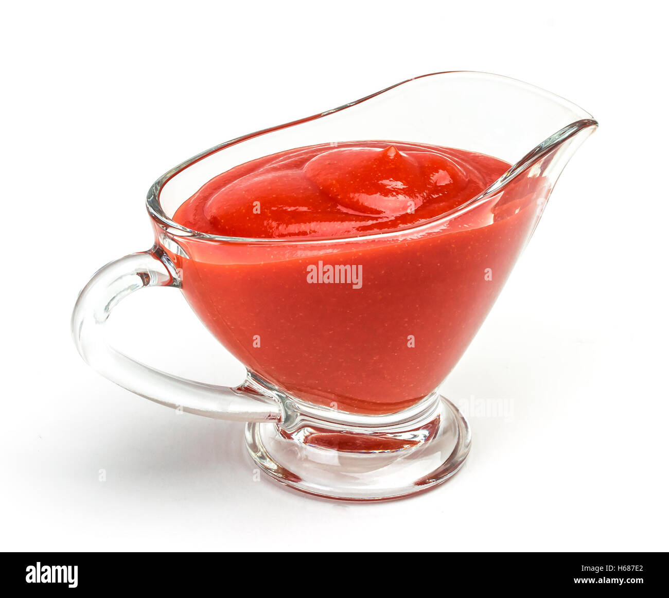 Libre de ketchup dans bol en verre, isolated on white Banque D'Images