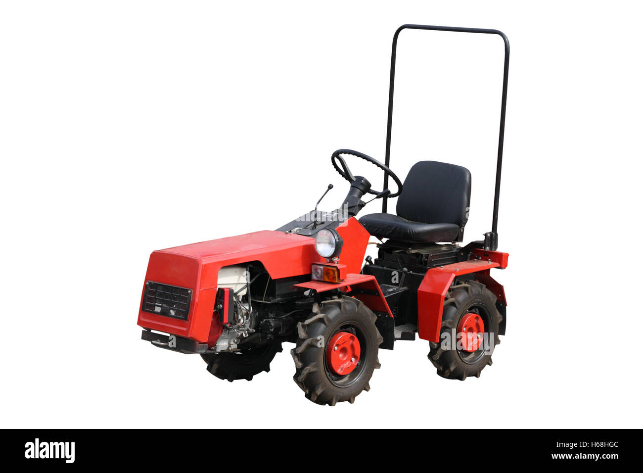 Tracteur rouge isolé sur fond blanc Banque D'Images