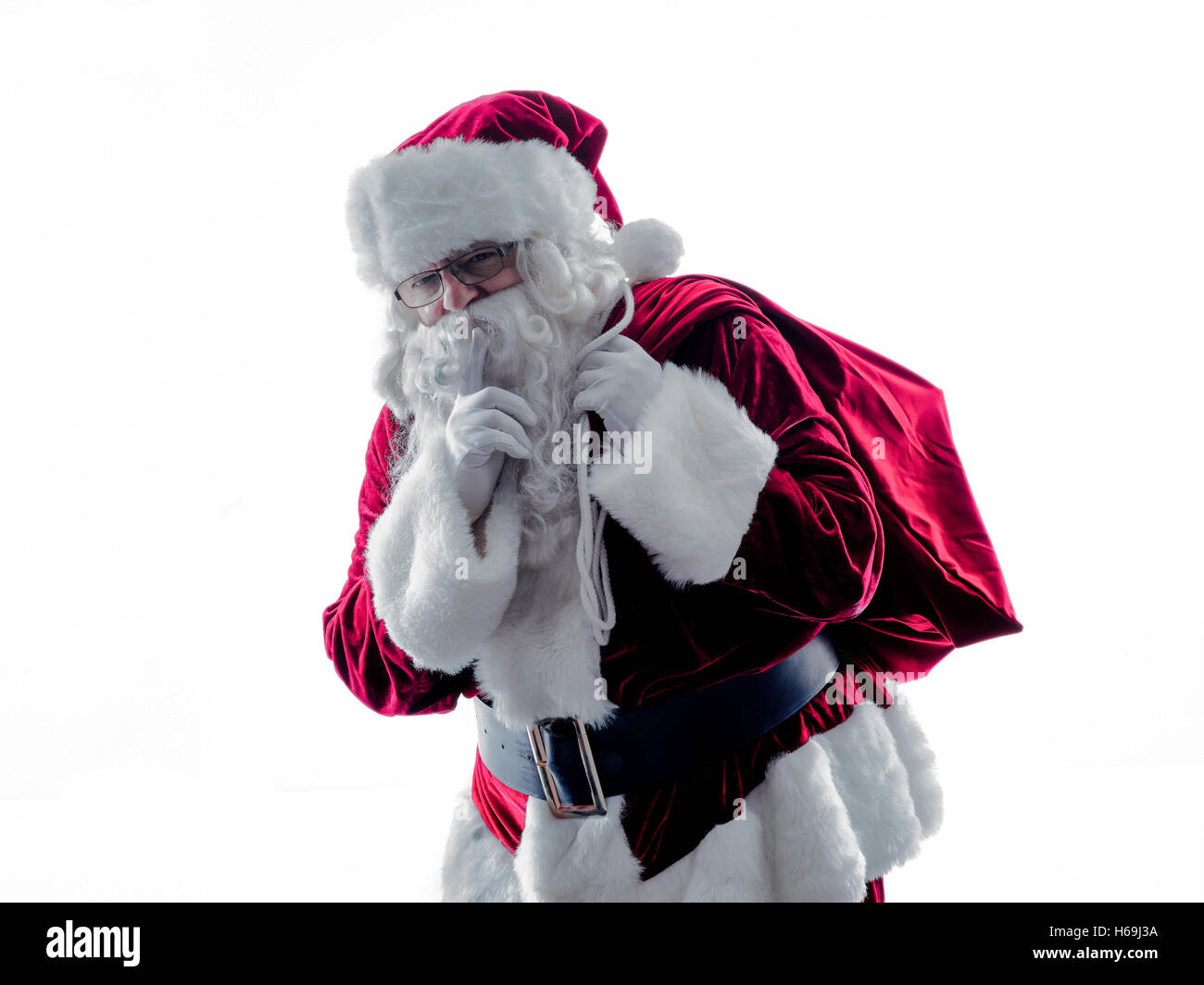 Un père noël man Hushing ossature isolé sur fond blanc Banque D'Images