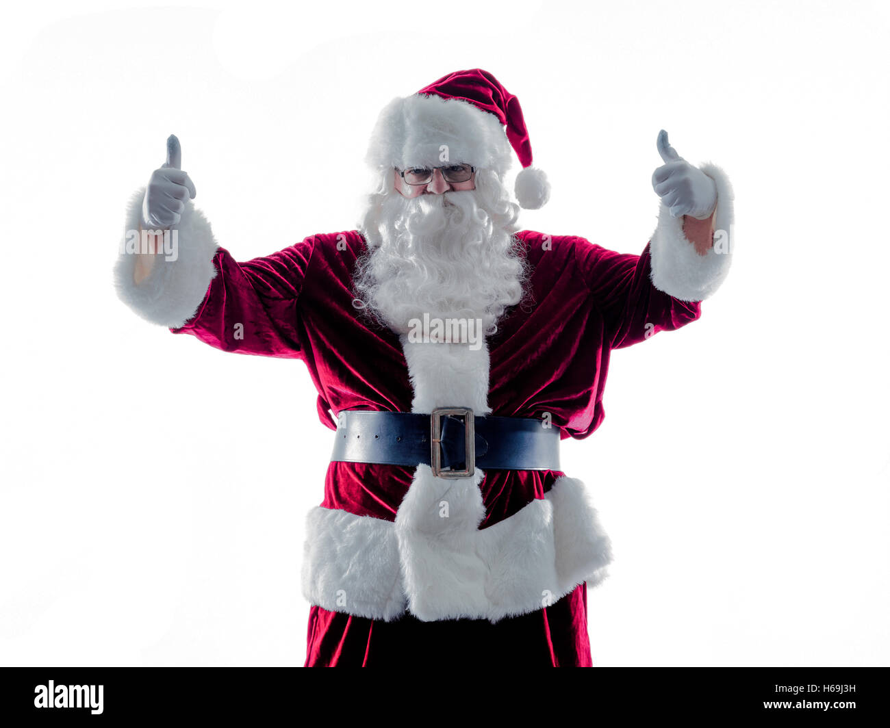 Un père noël homme Thumbs Up silhouette isolé sur fond blanc Banque D'Images