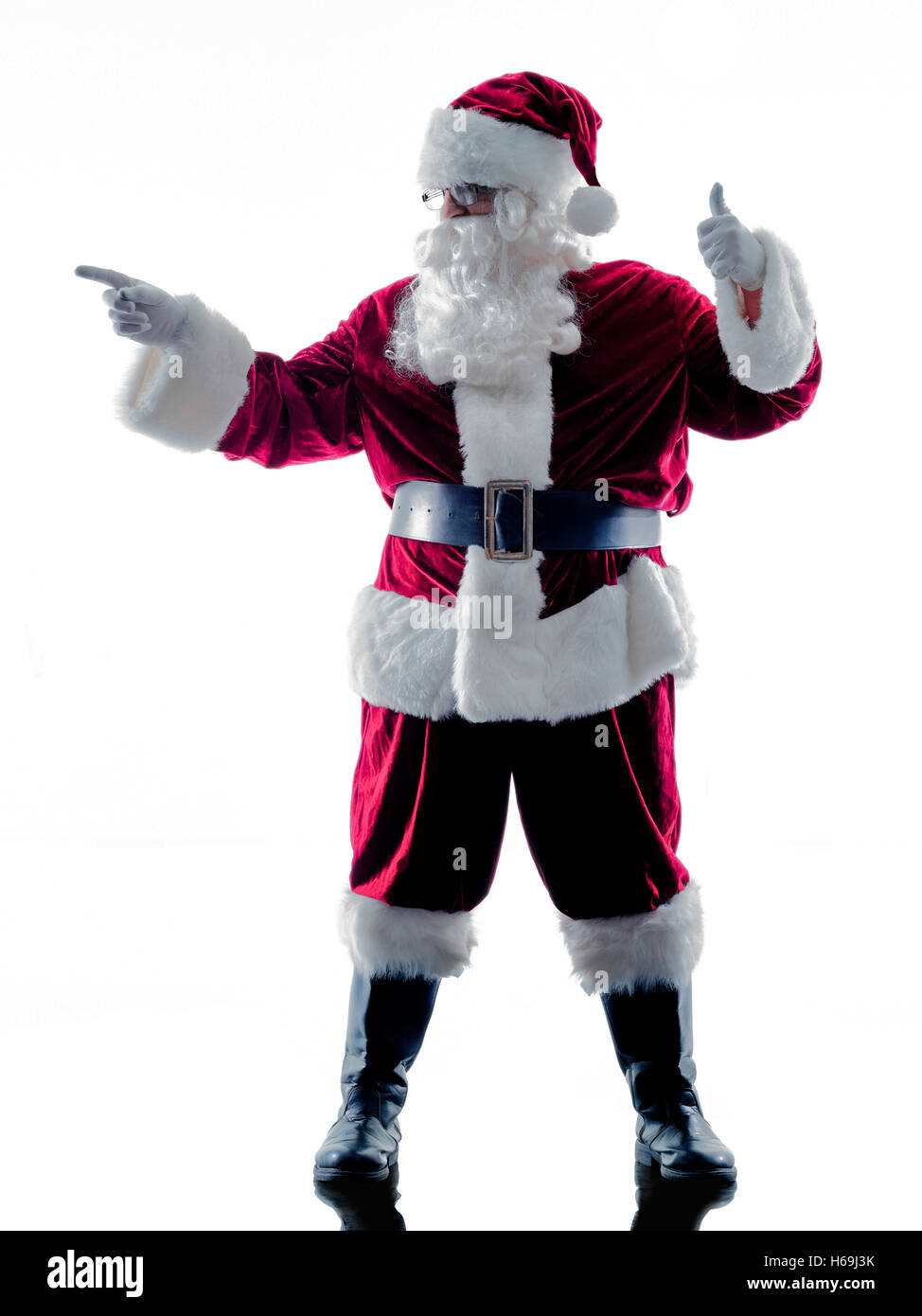 Un père noël man pointing silhouette isolé sur fond blanc Banque D'Images
