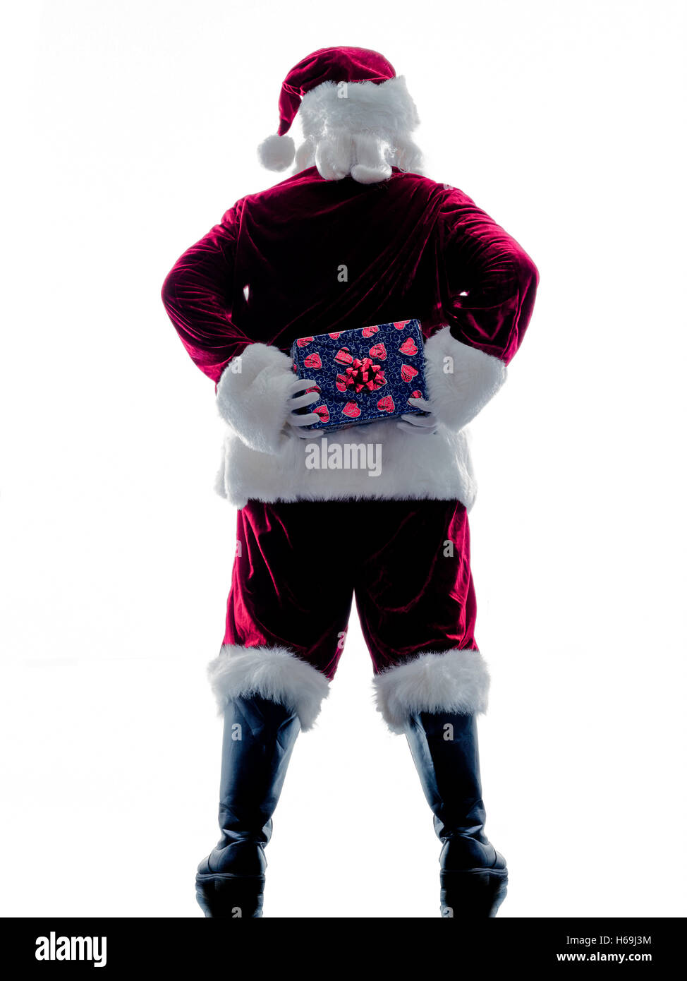 Un père noël man holding de donner des cadeaux d'ossature isolé sur fond blanc Banque D'Images