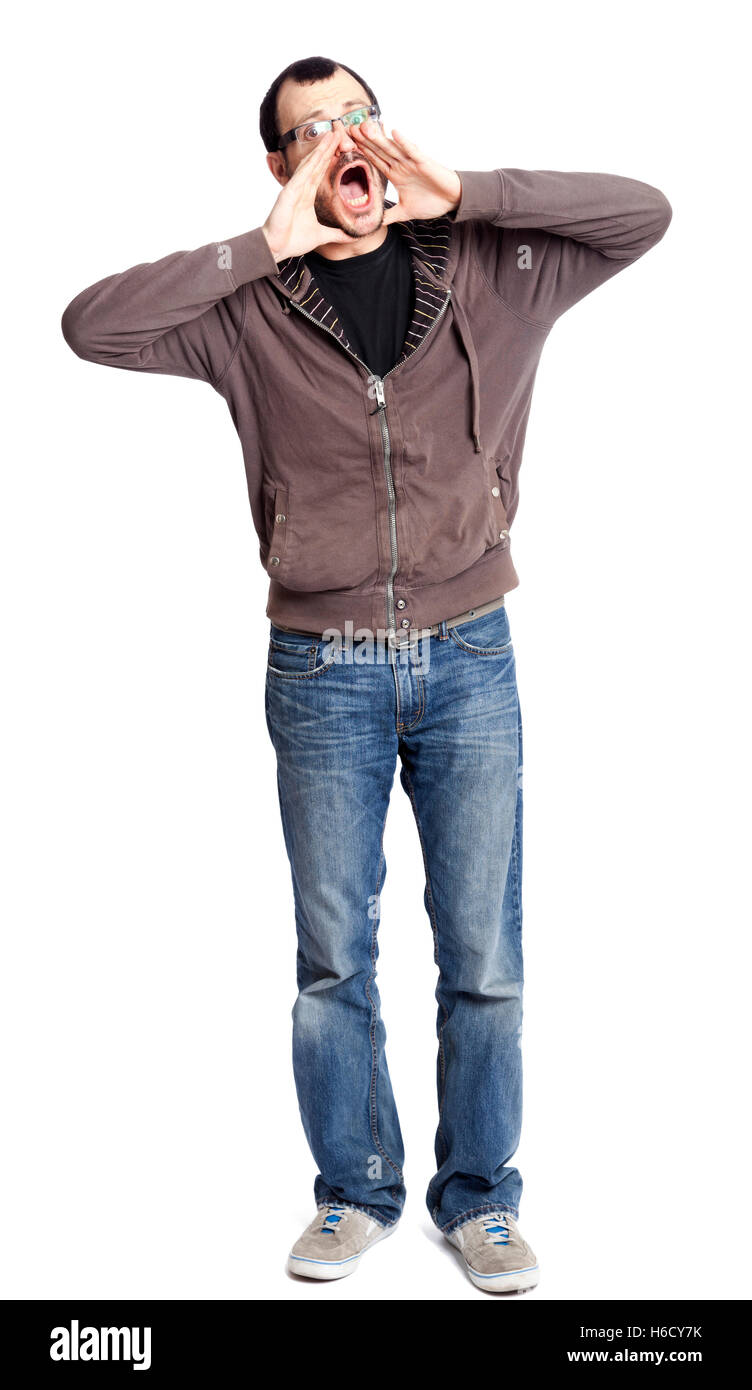 Un adulte caucasian man dans la trentaine portant des chaussures occasionnels, une paire de jeans et un sweat sur un t-shirt noir. Il est lo Banque D'Images