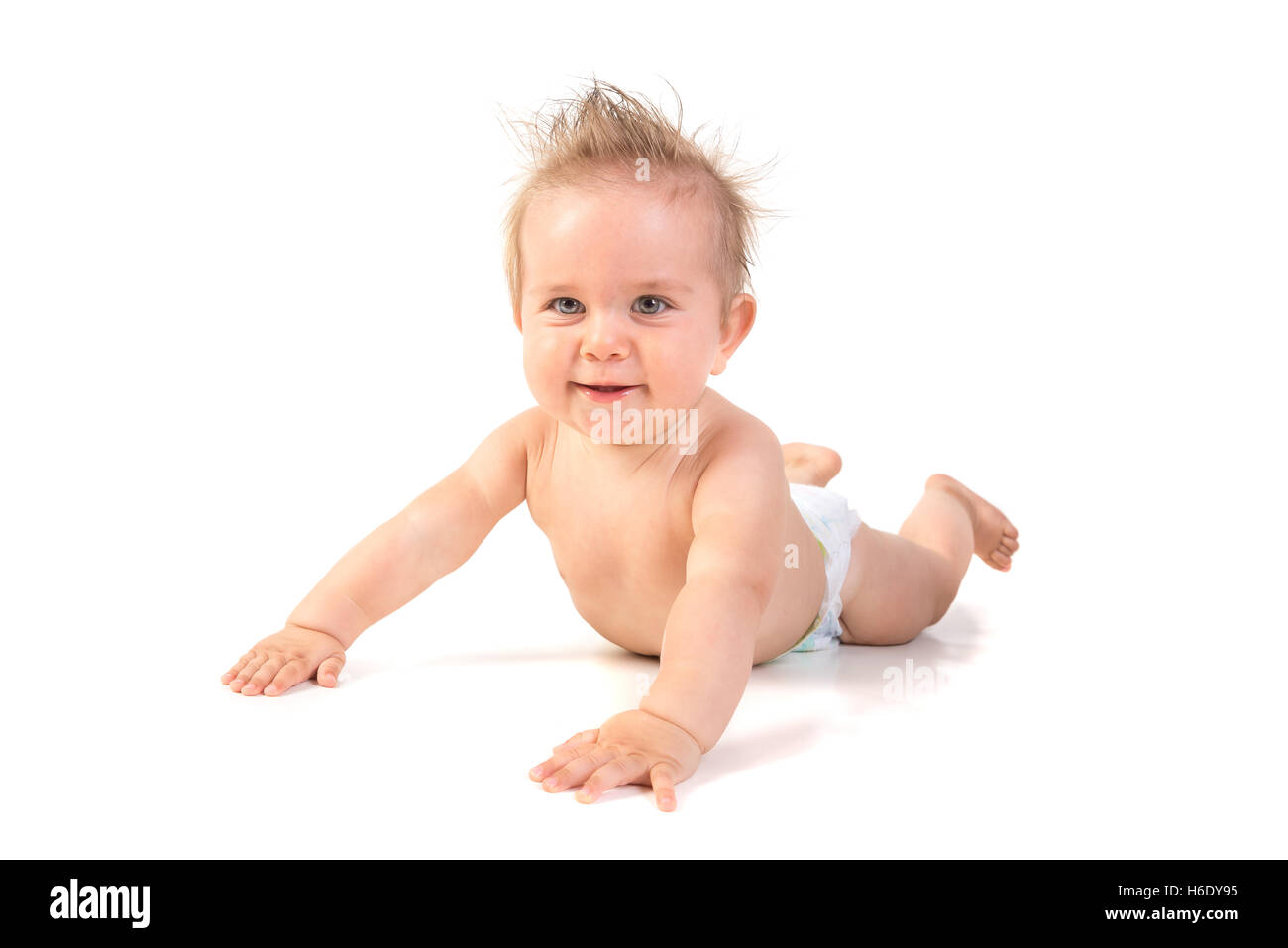 Magnifique petit garçon posant isolé en fond blanc Banque D'Images