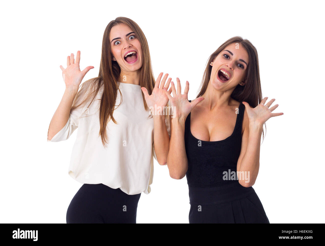 Deux jeunes woman holding hands up Banque D'Images