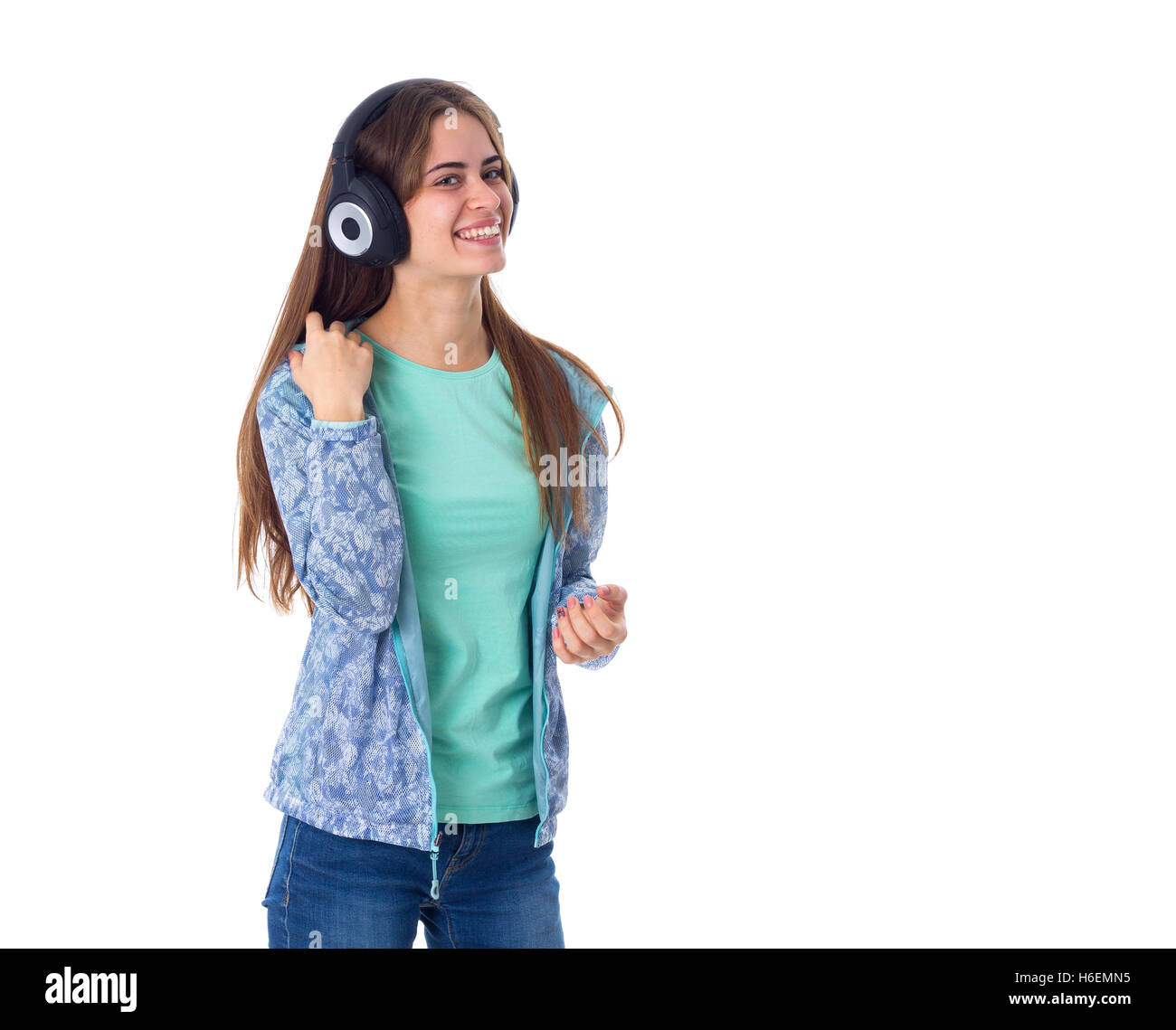 Jeune femme dans les écouteurs Banque D'Images Jeune femme dans les écouteurs Banque D'Images