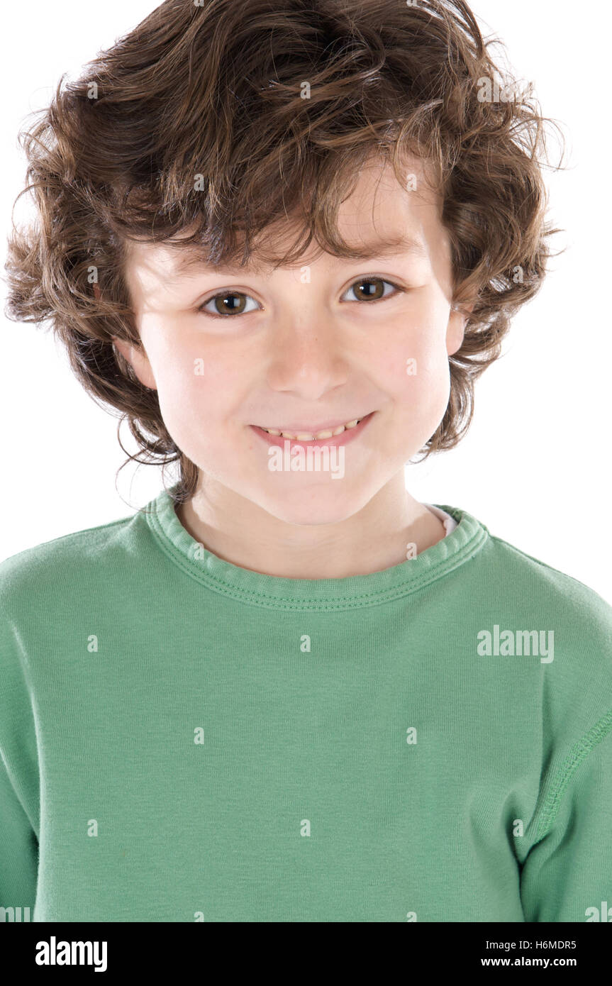 Smiling boy with six ans looking at camera isolé sur fond blanc Banque D'Images