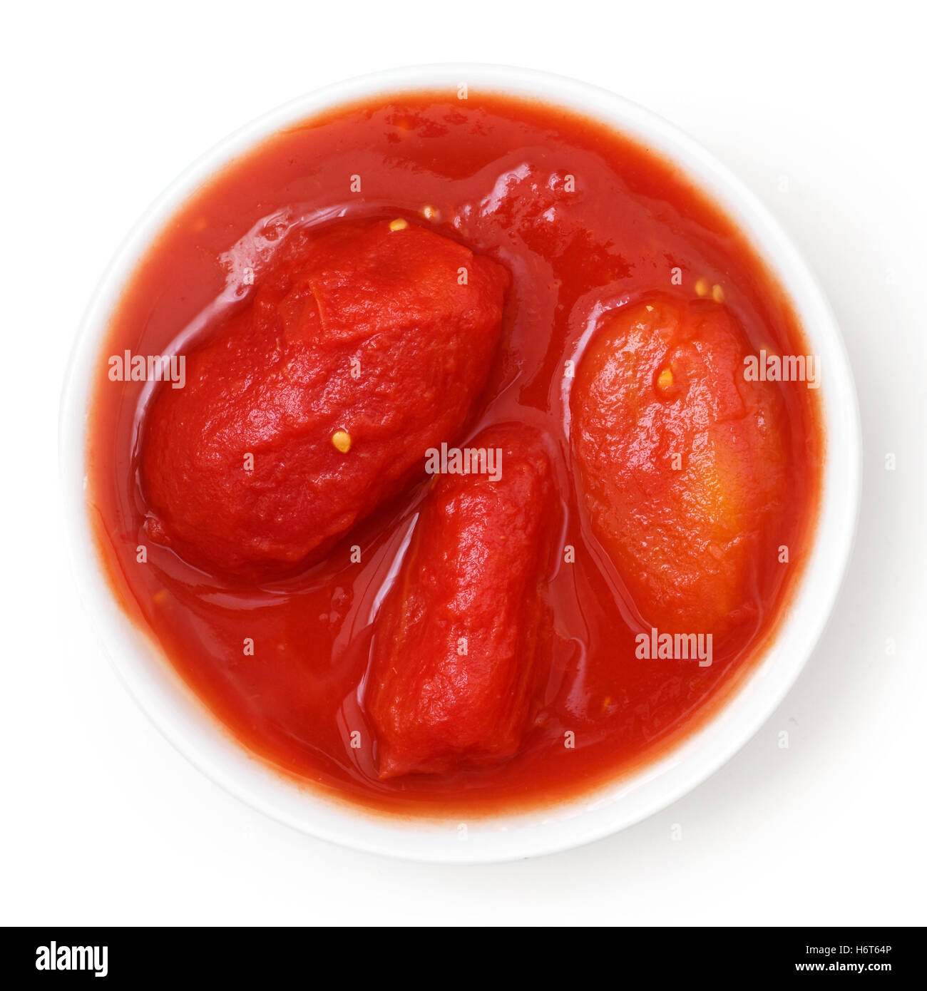 Tomates en conserve tout en blanc. Au-dessus isolé. Banque D'Images