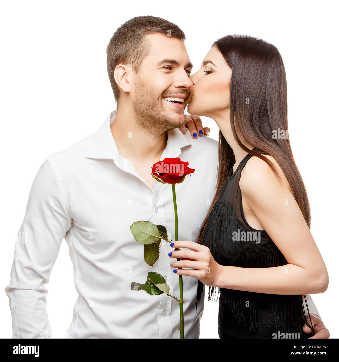 Jeune beau couple avec fleurs isolated on white Banque D'Images