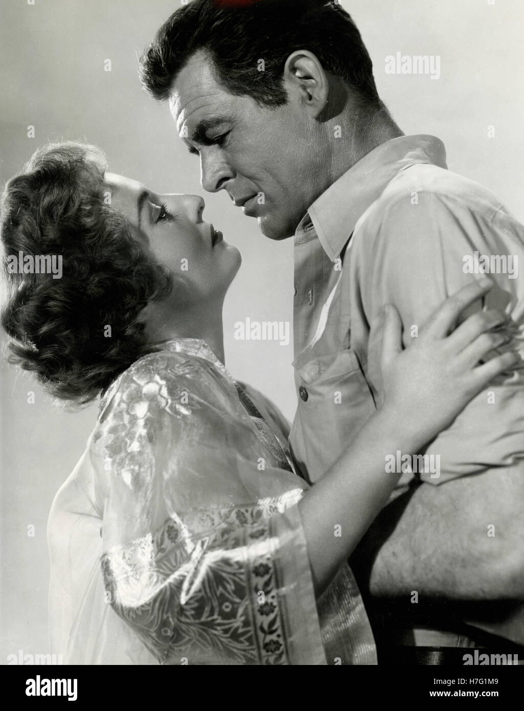 Acteurs Robert Ryan et Barbara Stanwyck dans le film s'échapper vers la Birmanie, USA 1955 Banque D'Images