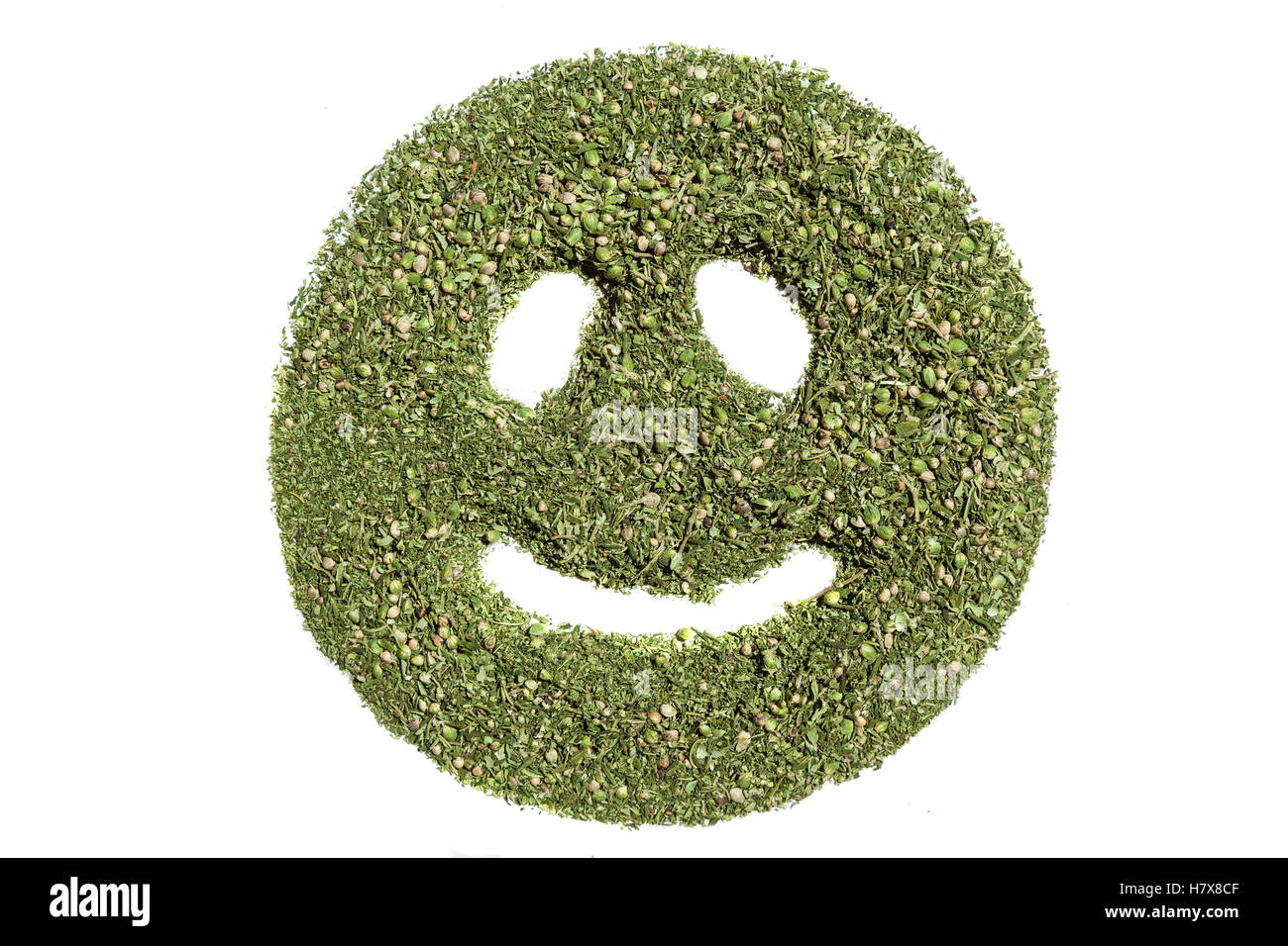 Smiley emoticon smiley emoticon.heureux fait d'herbe verte du cannabis. Banque D'Images