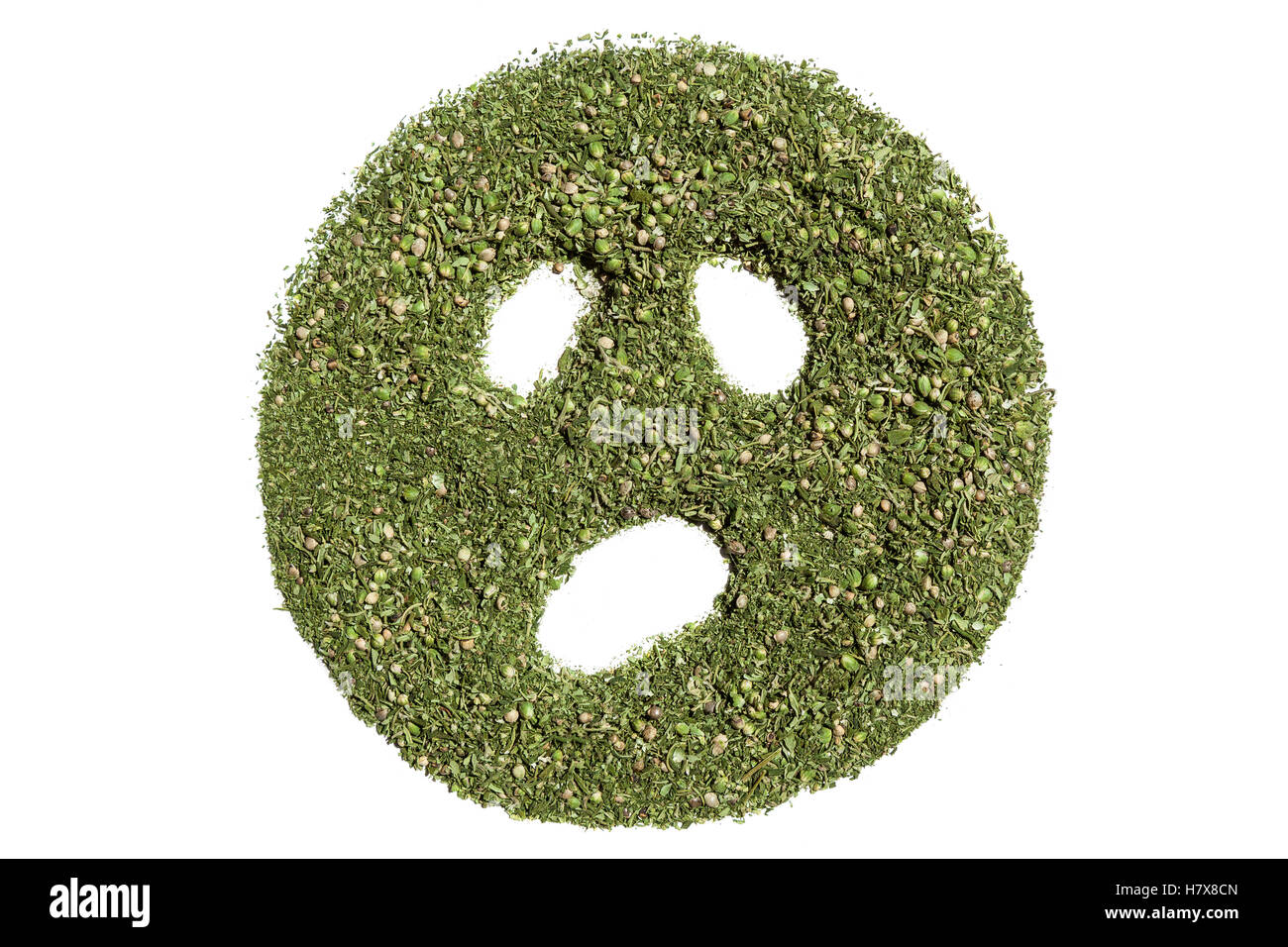 Sourire du chanvre.sourire visage, faite de cannabis vert sur fond blanc. Banque D'Images