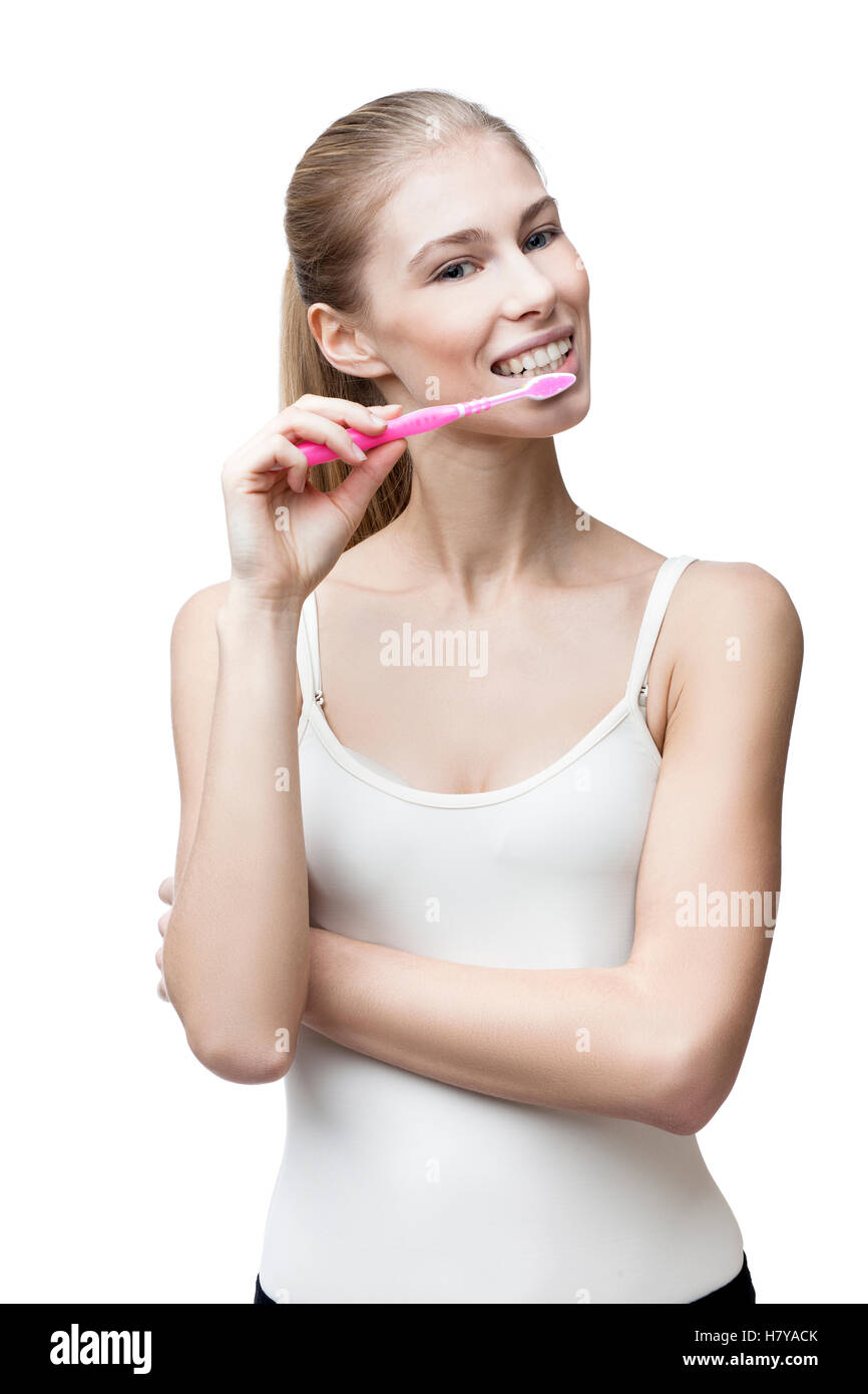Jeune femme blonde avec une brosse à dents Banque D'Images