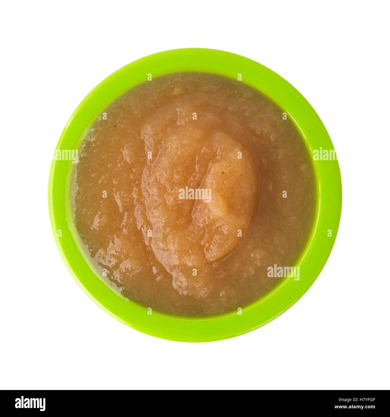 Vue de dessus d'une portion de compote de cannelle dans un petit bol vert isolé sur fond blanc Banque D'Images