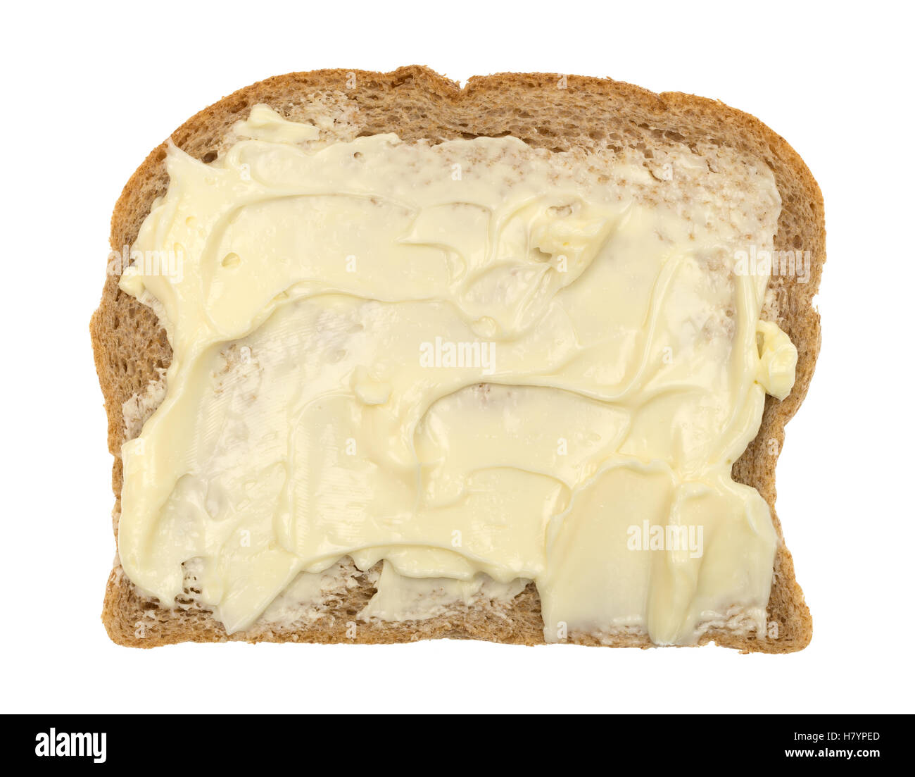 Vue supérieure d'une tranche de pain de blé avec de la mayonnaise et de la margarine isolé sur un fond blanc. Banque D'Images